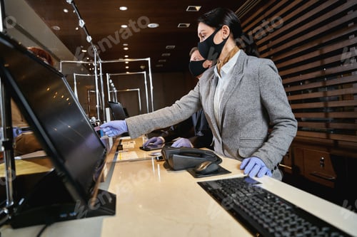 Preview: Hotel receptionists following the pandemic safety precautions
