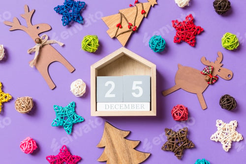 Preview: Top view of wooden calendar. The twenty fifth of December. New Year decorations