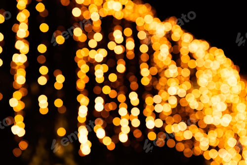 Preview: Festive bright blurred golden black background Christmas. yellow bokeh lights shining out of focus