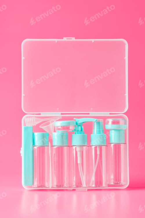 Preview: Travel Size Bottles in a Clear Plastic Case on Pink Background