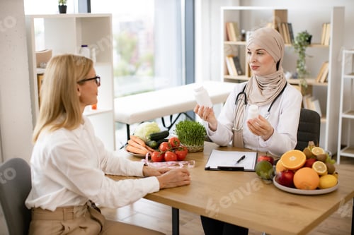 Preview: Muslim woman nutritionist makes plan for treatment of gastrointestinal tract.