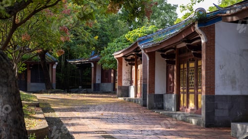 Preview: Traditional Asian architecture amidst greenery.