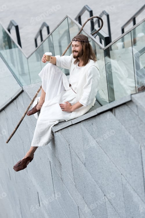 Preview: smiling Jesus in robe and crown of thorns sitting on staircase side and holding disposable coffee