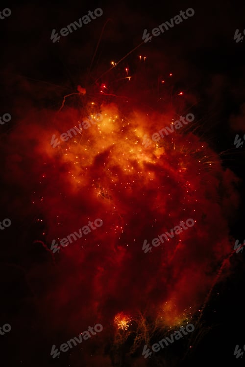 Preview: Fireworks exploding behind a wall of smoke
