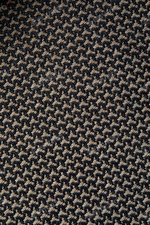 Preview: Knitted texture. Texture of jacquard fabric with gray geometric pattern. Crochet mosaic pattern.