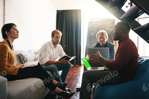 Preview: Shot of a diverse group of designers brainstorming together in an office