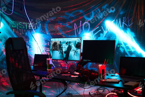 Preview: Empty Hacker Workspace Featuring Multiple Monitors and Neon Lighting Effects
