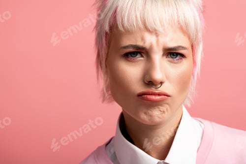 Preview: Young beautiful woman with playful expression in vibrant pink background highlighting her charm