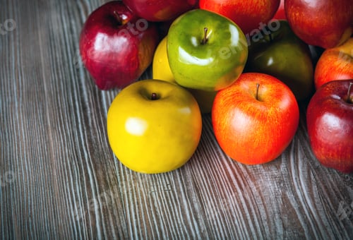 Preview: Red apples on wooden table close up top view