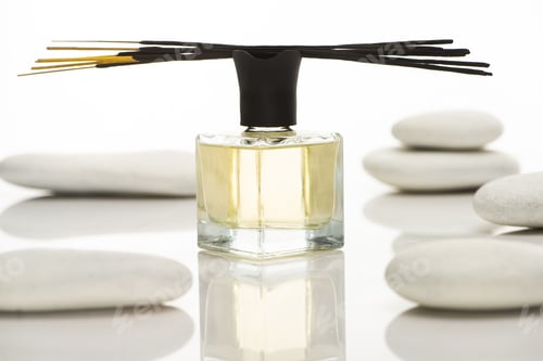 Preview: Selective Focus of Aroma Sticks And Perfume Near Spa Stones Isolated on White
