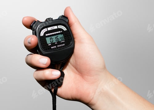Preview: Hand Holding Black Digital Stopwatch for Timekeeping