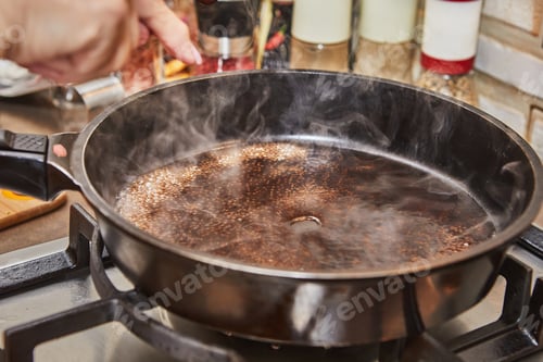 Preview: Caramelized syrup in frying pan on gas stove