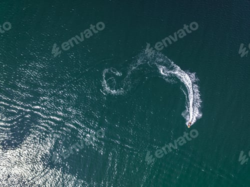 Preview: Aerial view of man riding jet ski on Baltic sea.