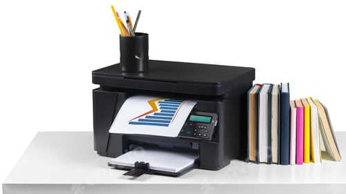 Preview: Printer on a desk with printed paper and a stack of books nearby in an office setting