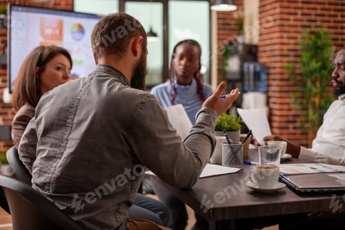 Preview: Caucasian man speaking to his colleagues