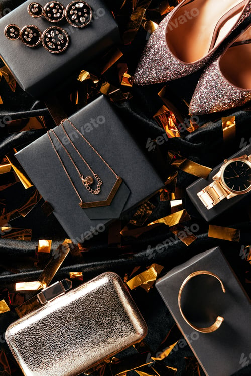 Preview: flat lay with feminine shoes, purse and jewelry on black background with golden confetti