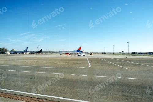 Preview: Several planes parked at the airport on loading