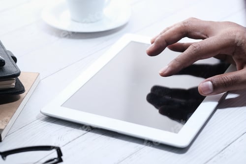 Preview: businessman using digital tablet on office desk