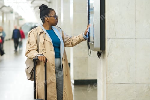 Preview: Side view of young African American woman scrolling through route map