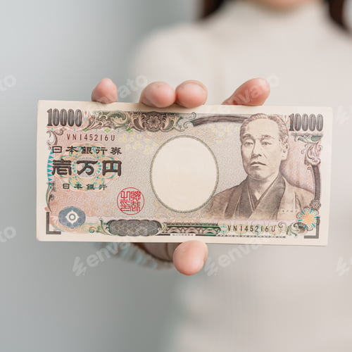 Preview: hand holding Japanese Yen banknote stack. Thousand Yen money