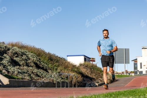 Preview: Running man. Male runner training resistance at Running track