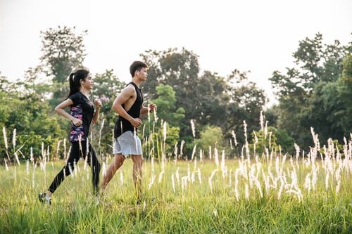 Preview: Men and women exercise by running.