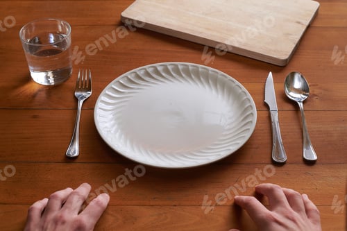 Preview: Point of view of a person about to eat on an empty porcelain plate