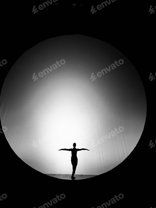 Preview: Silhouette of a dancer in front of circular light