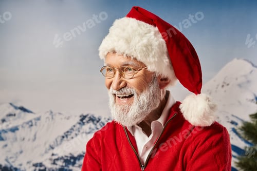 Preview: cheerful man in Santa red costume and glasses smiling happily with snowy backdrop, winter concept