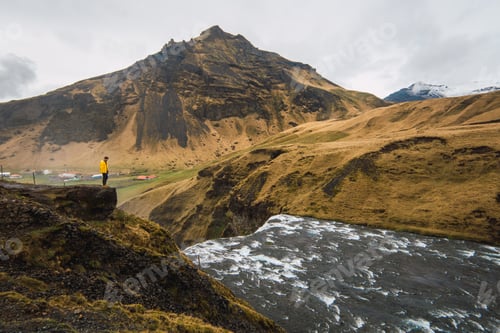 Preview: Lonely person on cliff above river