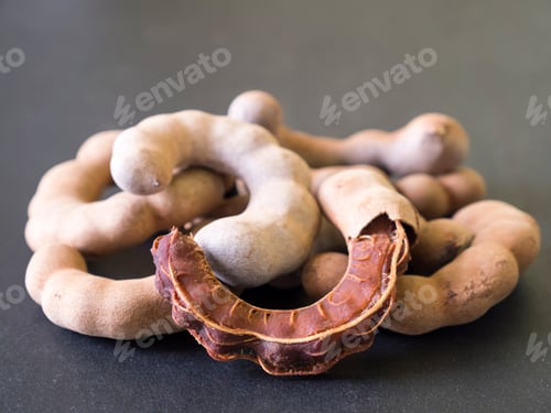 Preview: Sweet tamarind on black background. Soft focus