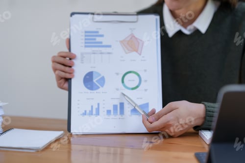 Preview: Businesswoman planning investment in a meeting.
