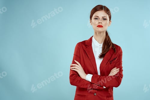 Preview: Elegant woman in red jacket bright makeup lips self-confidence cropped view blue background