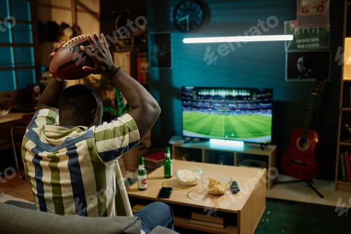 Preview: Young Football Fan Watching Match On TV