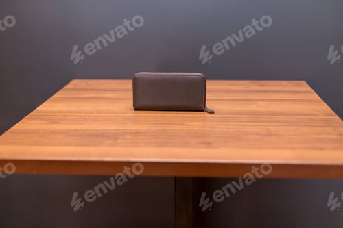 Preview: Brown leather wallet on the wooden table