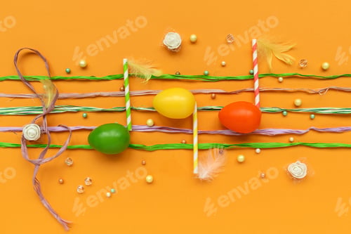 Preview: Musical notes make from Easter eggs on yellow background. Easter celebration concept. Top view