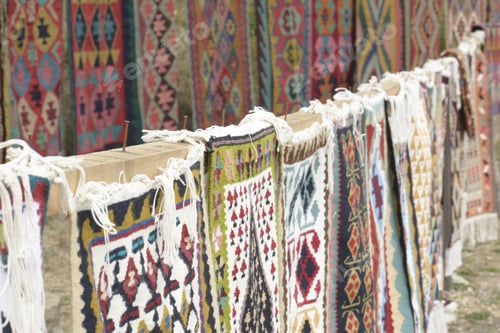 Preview: Oriental Iranian rugs or kilim with traditional folk geometric patterns presented for sale