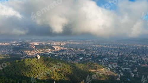 Preview: Aerial view of Barcelona City skyline above the clouds and fog, Catalonia, Spain