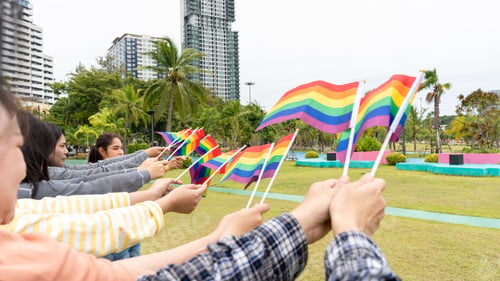 Preview: LGBTQ Rainbow Flags being waved symbol of Diversity Gay and lesbian for Celebration gay pride parade