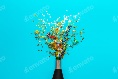 Preview: Champagne bottle with colorful party streamers