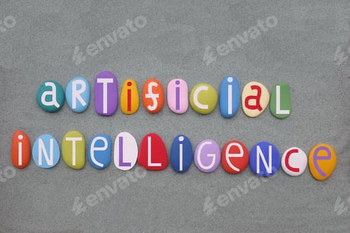 Artificial Intelligence, creative text composed with multi colored stone letters over green sand
