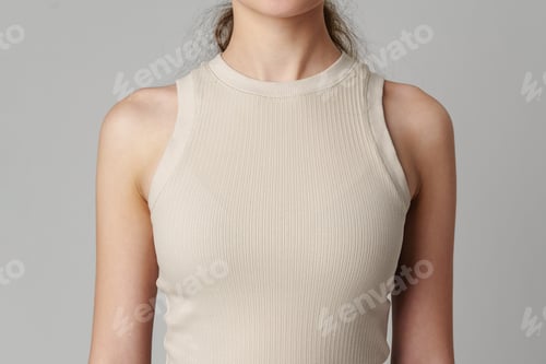 Preview: Female body in beige top on gray background