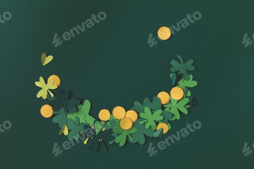 Preview: top view of paper decoration of coins and shamrock for st patricks day isolated on green