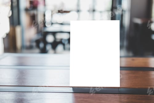 Preview: blank menu frame on table in coffee shop stand for your text of display your product