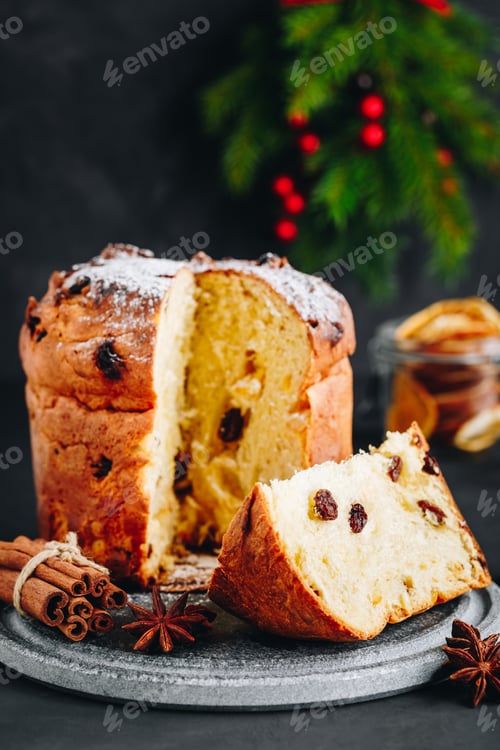 Preview: Traditional Christmas Panettone cake with dried fruits on dark stone background