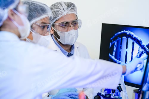 Preview: scientists in protective masks and goggles work closely together in a research