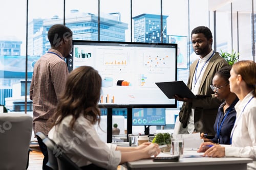Preview: Business associates collaborating at the conference table in boardroom