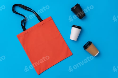 Preview: Orange Bag and Coffee Cups on Blue Background