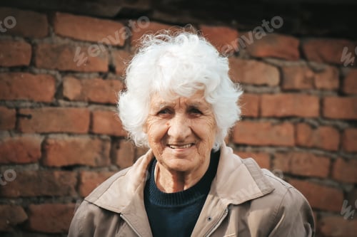 Preview: Beautiful grandma is smiling at the camera