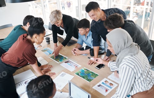 Preview: Shot of a group of businesspeople discussing paperwork during a meeting in a modern office